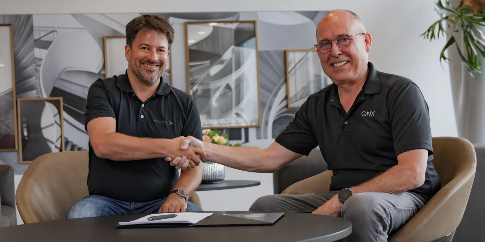 Two technology leaders join forces: Dr. Matthias Traub (Vector), left, and John Wall (QNX), right, during the signing of the Memorandum of Understanding to jointly develop the Foundational Vehicle Software Platform for SDVs. © Vector Informatik GmbH Vector_QNX_MoU_2025-6-23.jpg