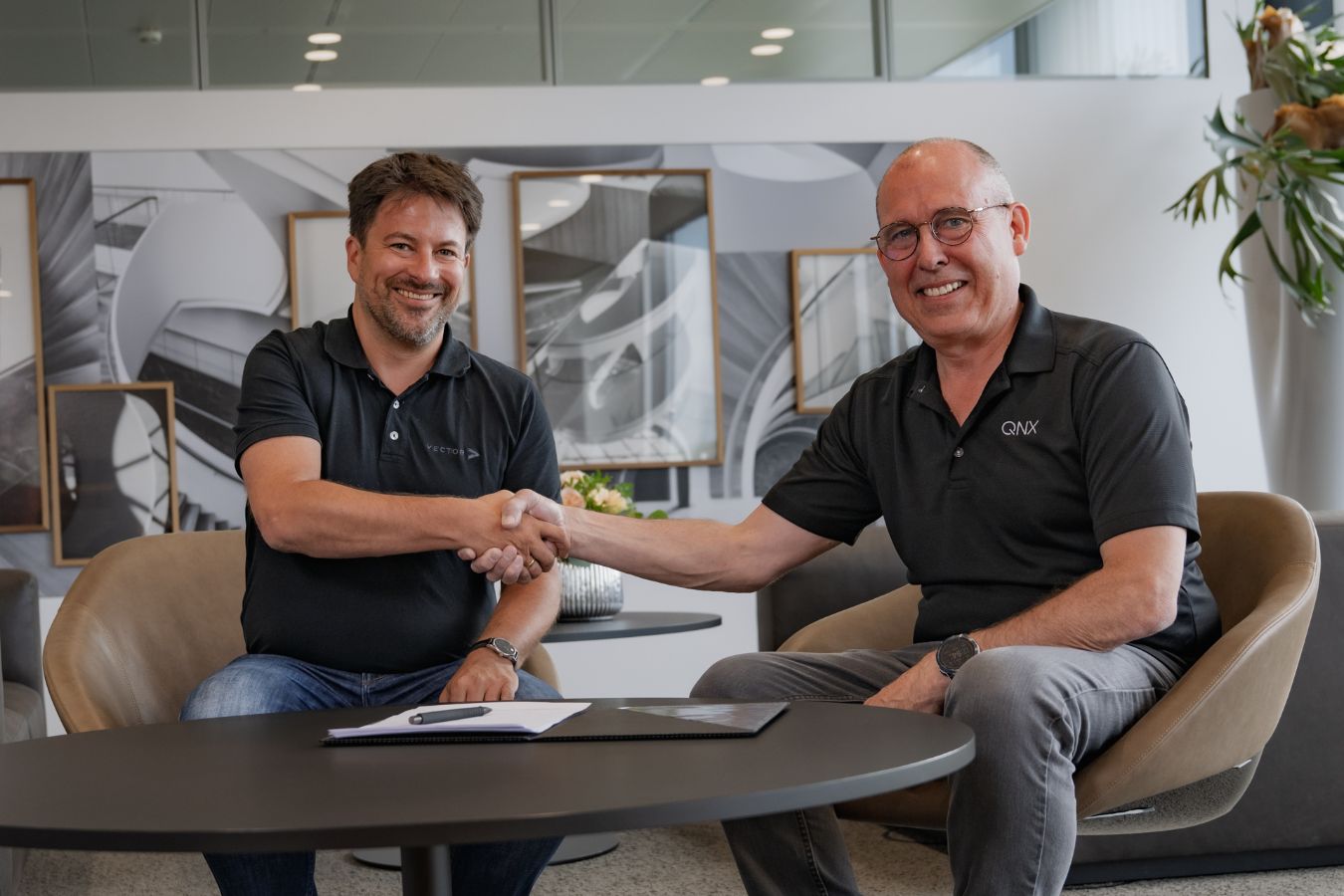 Two technology leaders join forces: Dr. Matthias Traub (Vector), left, and John Wall (QNX), right, during the signing of the Memorandum of Understanding to jointly develop the Foundational Vehicle Software Platform for SDVs. © Vector Informatik GmbH Vector_QNX_MoU_2025-6-23.jpg